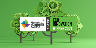 2021 Australian Business Awards Eco Innovation trophy photographed against a dark backdrop.
